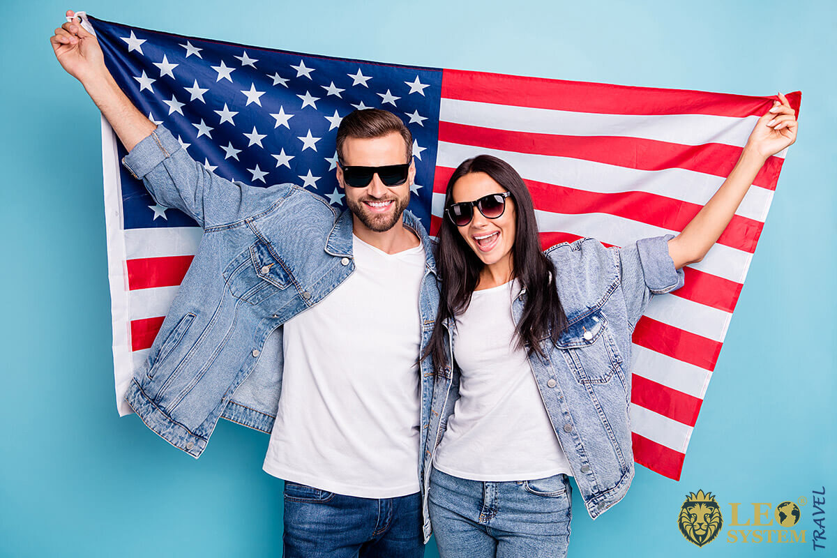Man and woman holding an American flag