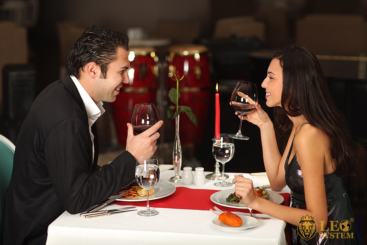 Man and woman celebrating New Year in a restaurant